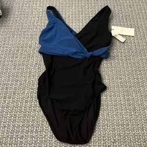 Never worn black one piece bathing suit with blue over lay
